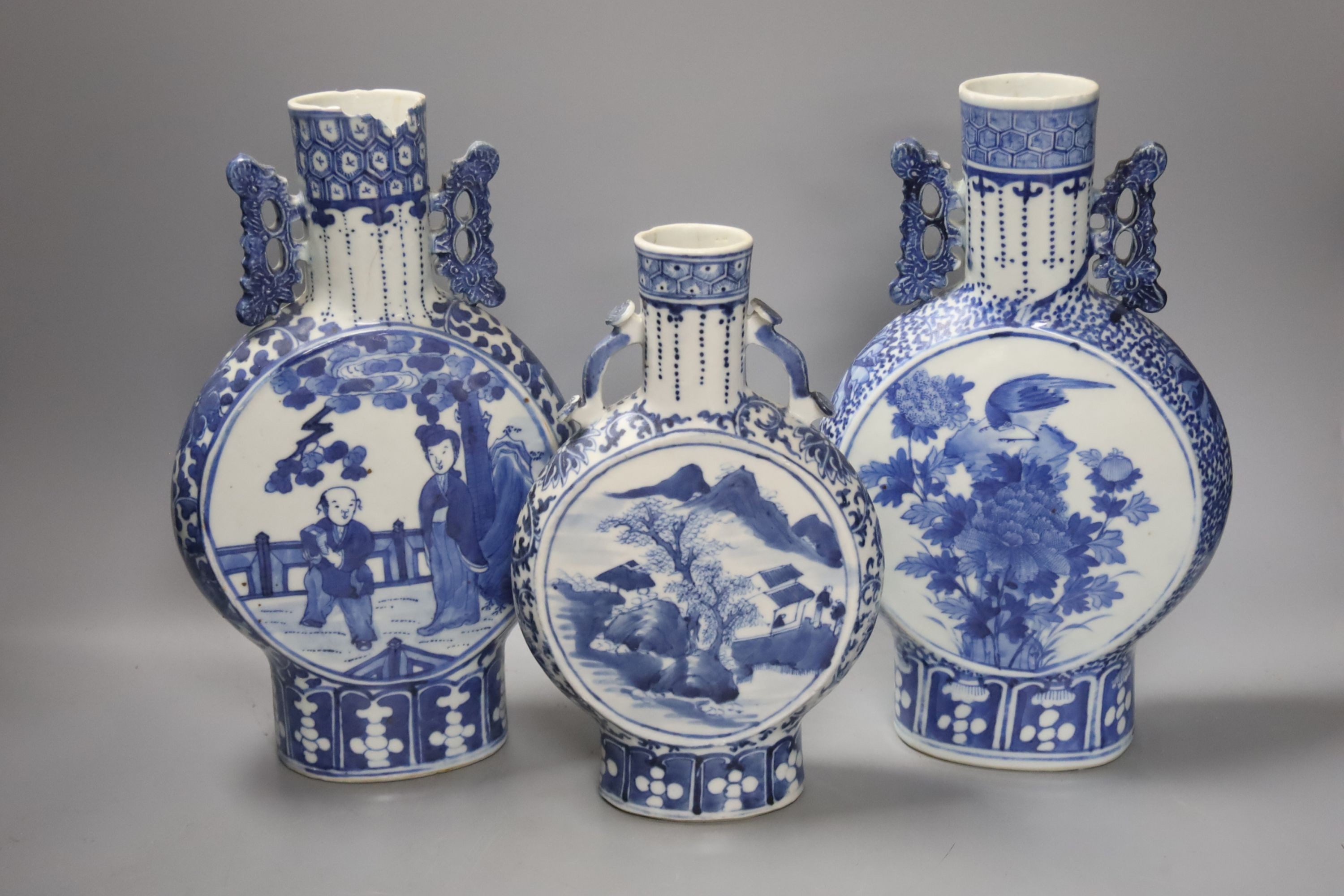 Three 19th century Chinese blue and white Moon flasks, tallest 31 cms.